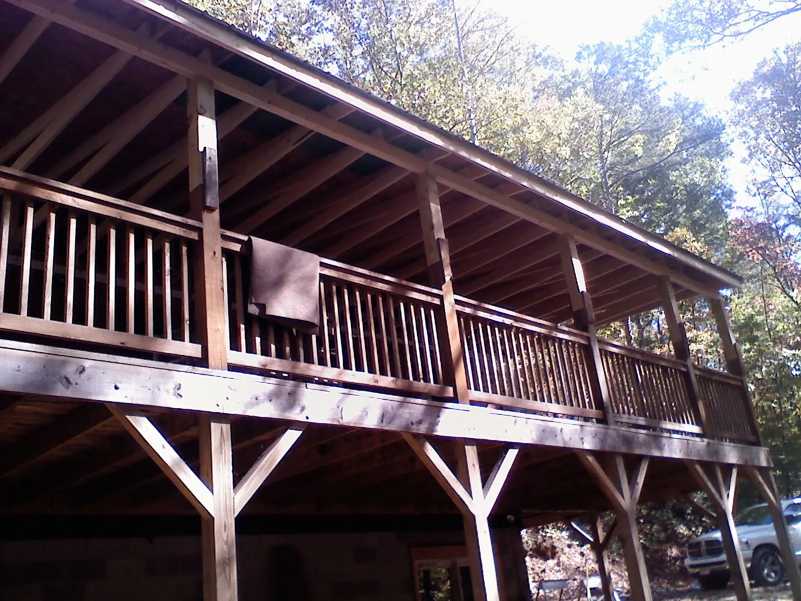 Timber framing under a new elevated porch and deck — Roof Leak Repair in Tyngsboro by Roofing Brothers